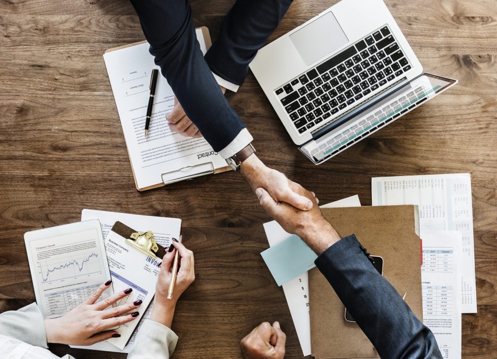 business people shaking hands together scaled - Welcome Lead