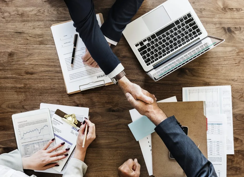 business people shaking hands together scaled - Welcome Lead